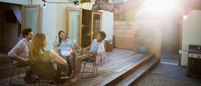 Friends sitting on a patio and chatting