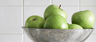 Green apples in a bowl