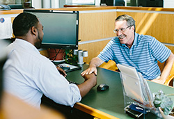 Dr Mark visits with a UFCU Representative 