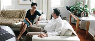 Couple sitting in living room